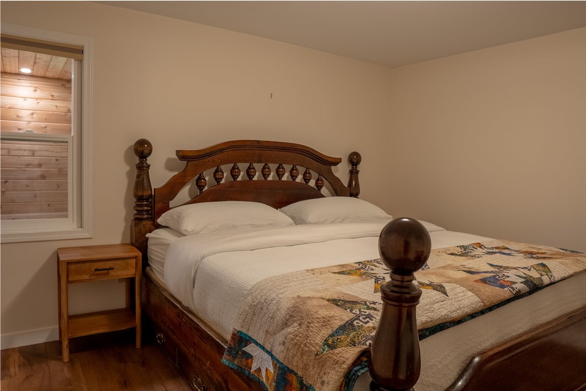 King bedroom with handcrafted wooden bed frame