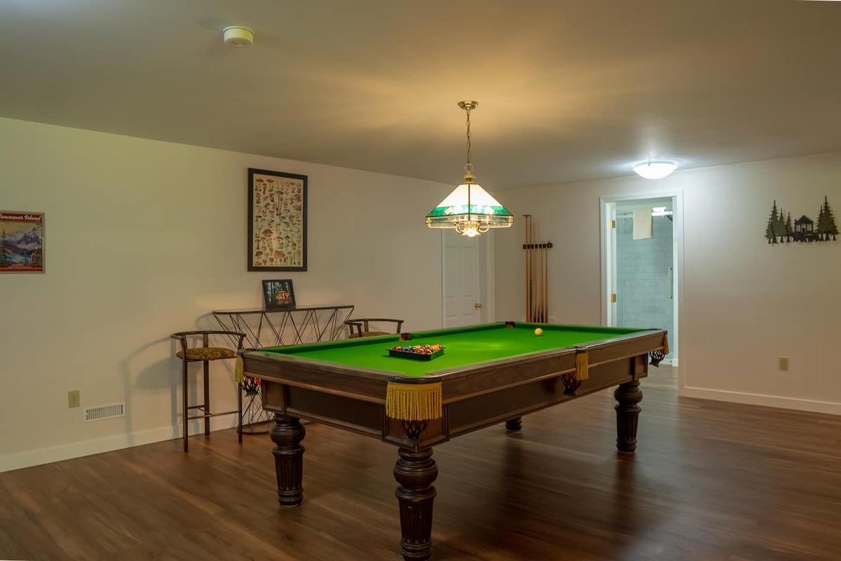 Games room with pool table and entertainment