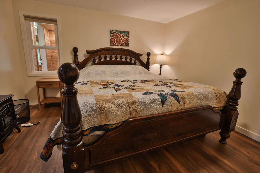 King bedroom with handcrafted wooden bed frame